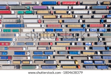 Background, texture or pattern. A huge queue of trucks at the border or terminal. Aerial view.