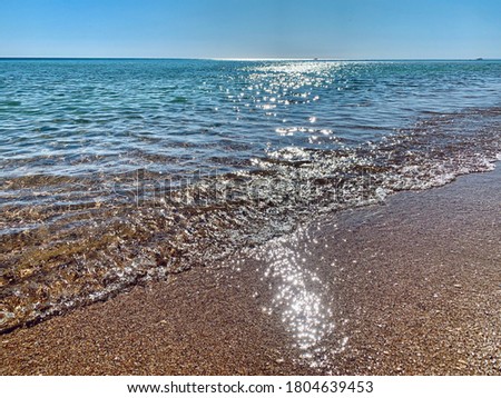 Clean sea water and sandy beach