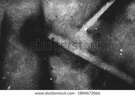 Image of scratched surface texture in black and white colors