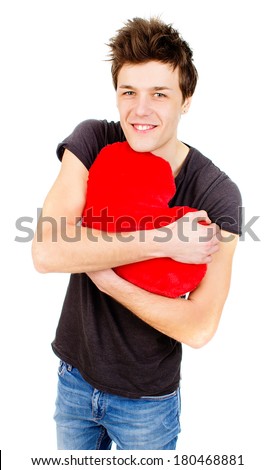 an image of cute man holding a toy heart