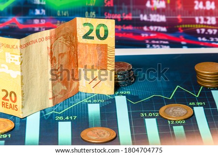 Brazilian money on a financial graph
