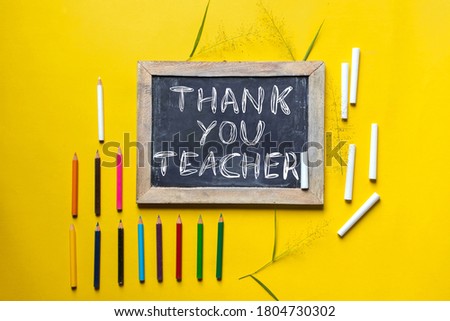 Thank You Teacher Written on Slate Board with Chalk and Color Pencils, Happy Teacher's Day Wish Conceptual Photo 