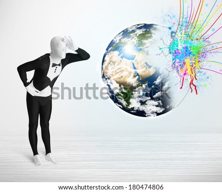 Funny man in body suit looking at colorful splatter 3d earth, Elements of this image furnished by NASA