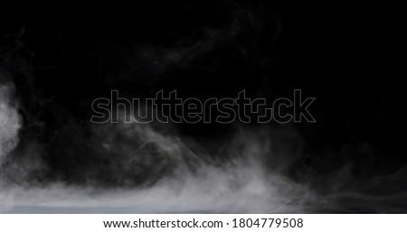swirling smoke rolling low across the ground. Royalty-Free Stock Photo #1804779508