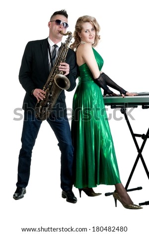Young man and woman with musical instruments saxophone and synthesizer on a white background isolated