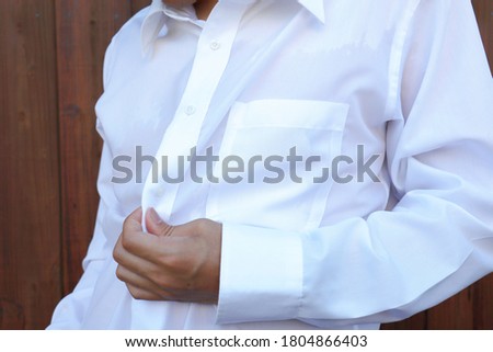 A Japanese man wearing a sweaty business shirt. Royalty-Free Stock Photo #1804866403