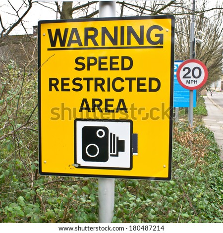 Yellow warning sign for speed cameras on a UK street