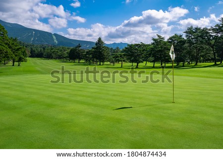 View of Golf Course with beautiful green field. Golf course with a rich green turf beautiful scenery.