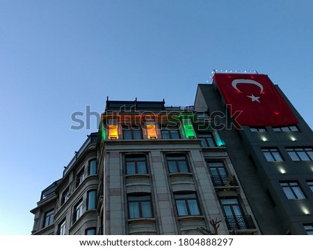 The Turkish flag is waving over the red and white old architecture Gothic style buildings, wonderful different perspective angles are perfect buying now.