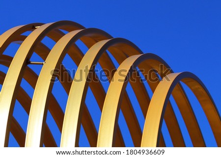 oval metal structures in the park area of the city