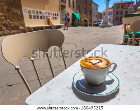 Having a Cup of Cappuccino in an Italian Town