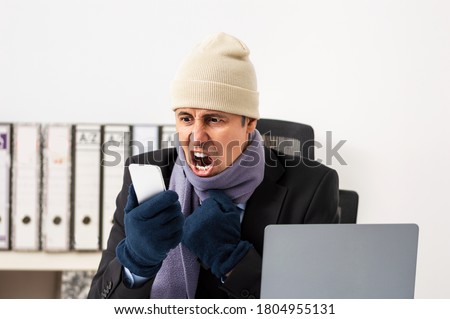Angry executive who is cold and calls technical service and they do not answer