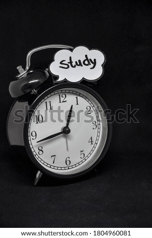 Study time and alarm clock on the table