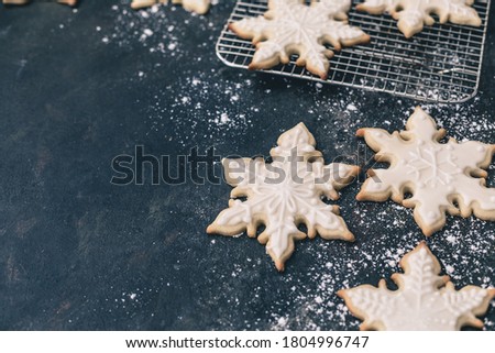 Homemade Snowflake Cookies on a Dark Blue Background