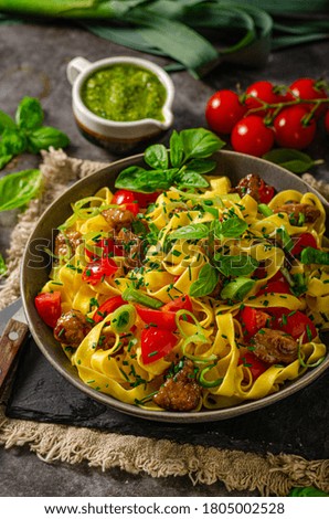 Organic noodles with meat and fresh vegetable and herbs