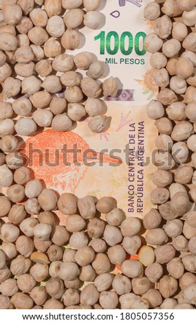 Legumes on Argentine peso banknote, world agricultural economy.