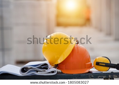 Close-up helmet in the construction site  Royalty-Free Stock Photo #1805083027