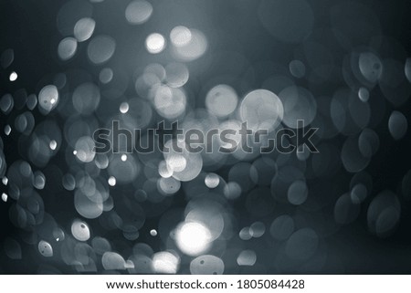 Abstract glitter bokeh on blue background