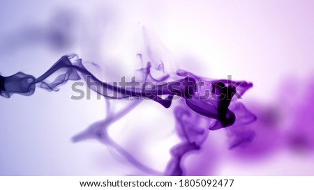 Isolated Purple Violet Ink Cloud floating in clear water. Shot on White Background with selective focus. Royalty-Free Stock Photo #1805092477