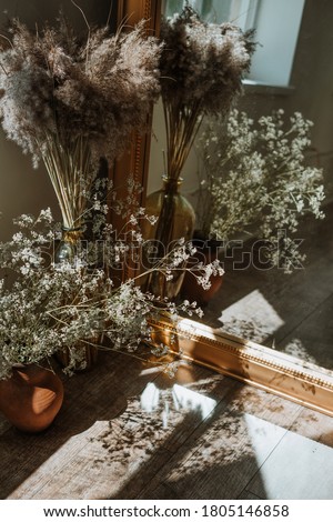 bouquet of dry flowers near mirror. home decor