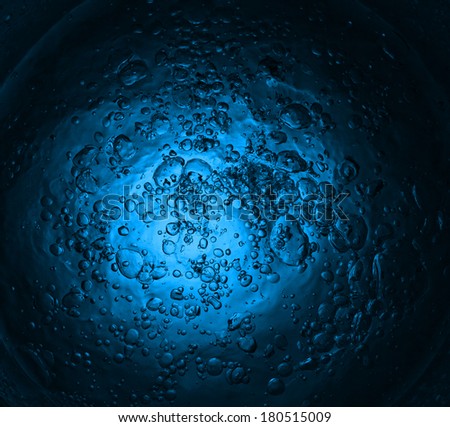 the flow of water formed beautiful background with bubbles