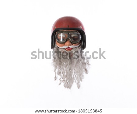 santa claus in motorcycle helmet isolated on white background