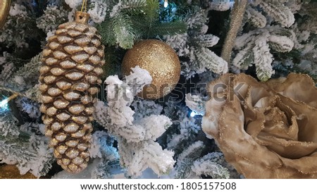 Close-up of a Christmas background. Celebration. Christmas tree with toys and decorative snow for a happy new year. Christmas decorations, New Year's atmosphere. Beautiful modern postcard.