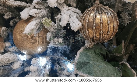Close-up of a Christmas background. Celebration. Christmas tree with toys and decorative snow for a happy new year. Christmas decorations, New Year's atmosphere. Beautiful modern postcard.