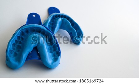 Dental technique blue bite impression Royalty-Free Stock Photo #1805169724
