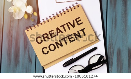 Text sign showing Creative Content. Conceptual photo providing showing with the type of content they re craving Papercraft craft paper desk square spiral notebook office study supplies.
