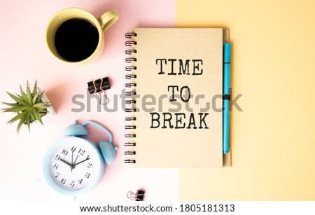 TIME TO BREAK is written in a notebook on a workplace near a flower, a diary and a calculator. Business concept