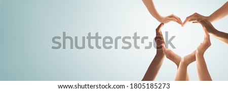 Symbol and shape of heart created from hands.The concept of unity, cooperation, partnership, teamwork and charity. Royalty-Free Stock Photo #1805185273