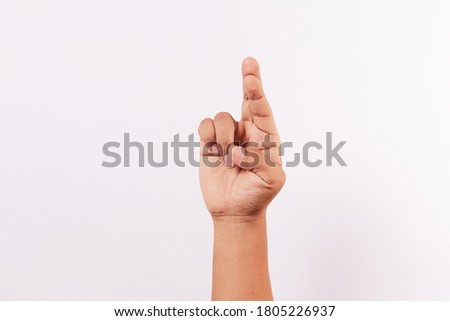 Letter R of the alphabet of Sign Language of Peru and America. Latin Peruvian man hands.
