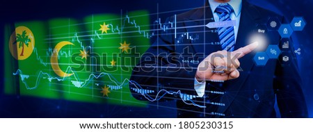 Businessman touching data analytics process system with KPI financial charts, dashboard of stock and marketing on virtual interface. With Cocos (Keeling) Islands flag in background.
