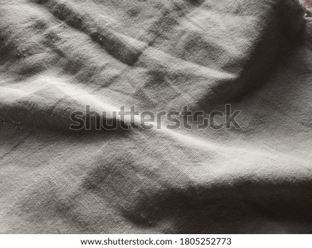 closeup and textured image of light colored cloth