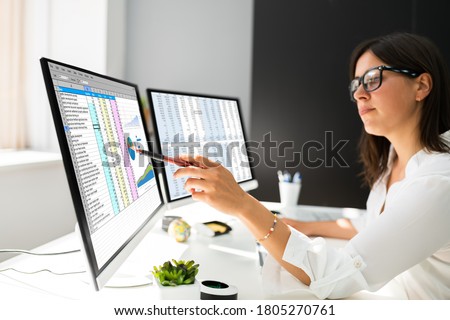 Analyst Working With Spreadsheet Business Data On Computer Royalty-Free Stock Photo #1805270761