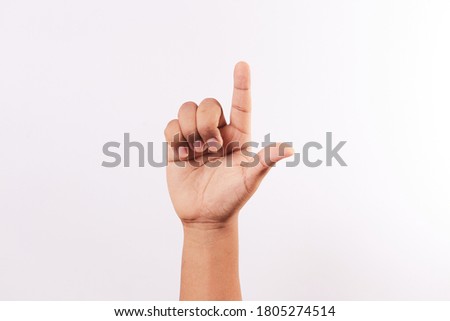 Letter L of the alphabet of Sign Language of Peru and America. Latin Peruvian man hands.
