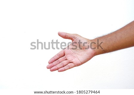 A picture of a man's hand preparing to shake hands  On a white background.