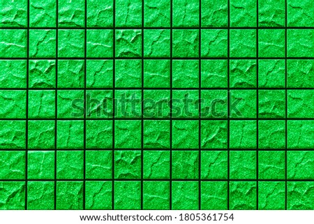 Green mosaic wall tile pattern and seamless background , Green stone tile wall or floor seamless background