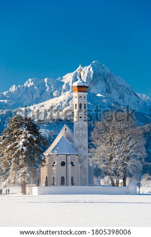 beautiful panoramic landscape in Bavaria at winter with church st. coloman