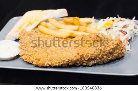 Fried fish with chunky chips.
