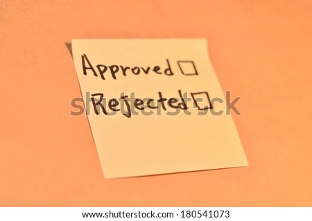 Text approved rejected on the short note texture background