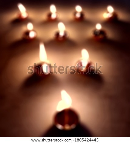 Blur diya in Happy Diwali -  An abstract blurred background picture of diya oil lamp with copy space. Hindu Festival concept background.