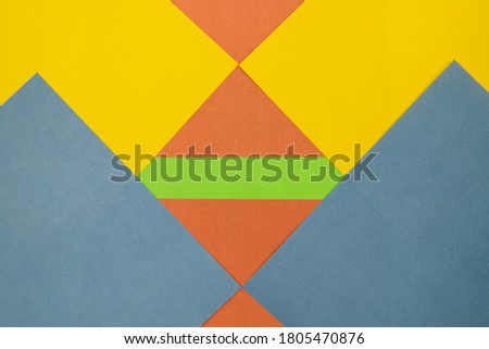 Grey, Purple, Orange and Blue coloured paper background, abstract contrast conceptual image