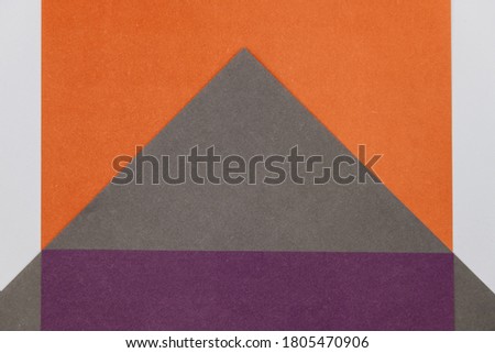 Grey, Purple and Orange coloured paper background, abstract contrast conceptual image