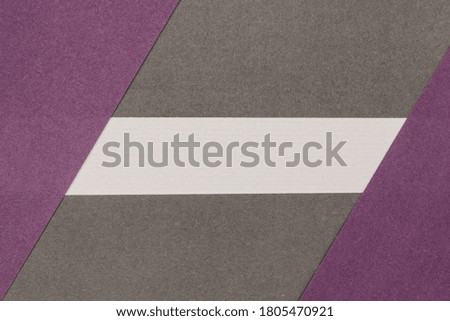 White, Grey and Purple coloured paper background, abstract contrast conceptual image