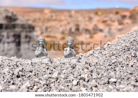 Conceptual Photo Picture of an Buddha in the dry desert