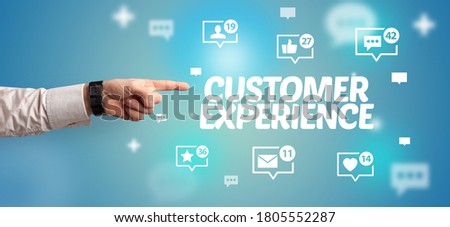 Close-Up of cropped hand pointing at CUSTOMER EXPERIENCE inscription, social networking concept