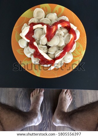 bachelor's dinner of dumplings and ketchup and mayonnaise in the shape of a heart