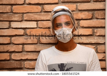 
man wearing mask and visor
